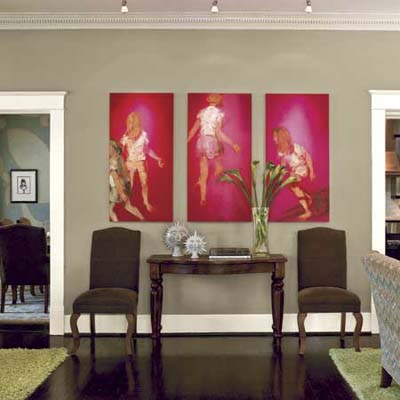 Living room with pink artwork.