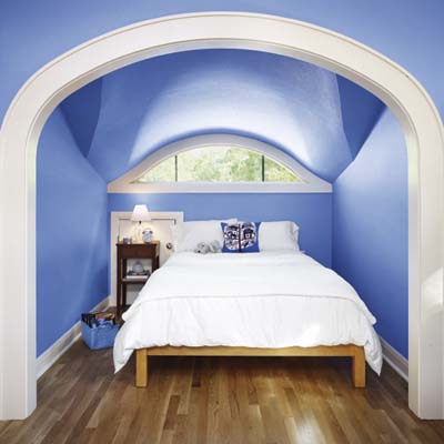 A bright, blue upstairs bedroom