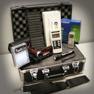 A brief case full of ghost hunting equipment.