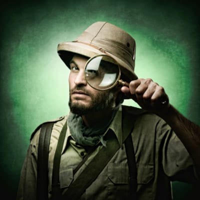 A man with a magnifying glass.