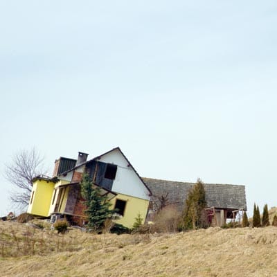 A house sliding down a hill.