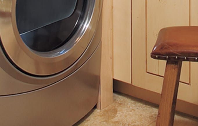 Close-up on stone floor tiles under dryer.