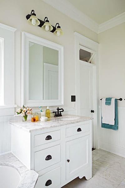 A vanity and mirror in the bathroom