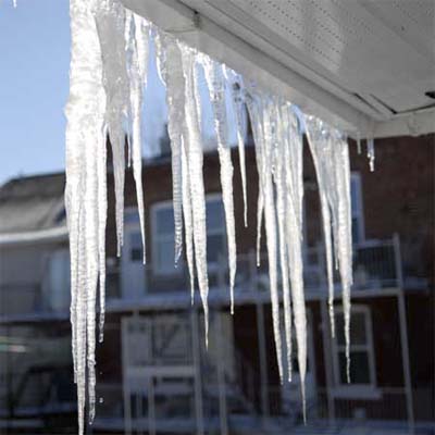 Icicles hanging off of a house