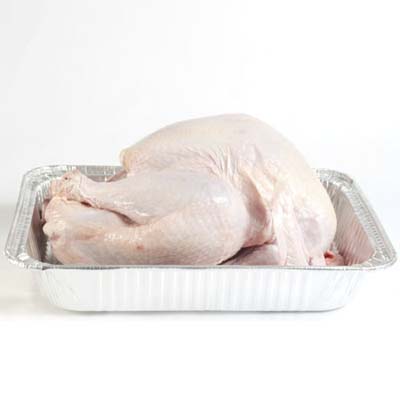 A raw turkey in a tray