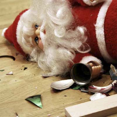A Santa doll laying on the ground