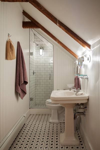 The guest bath with a slanted ceiling