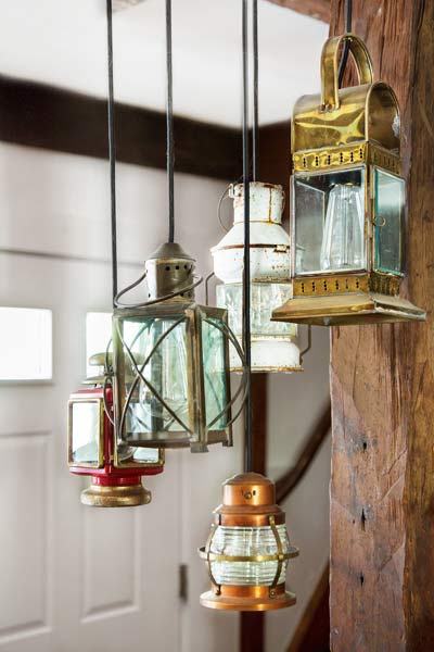 Nautical-themed lanterns hanging from the ceiling