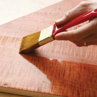 Hand painting on oil-based polyurethane.