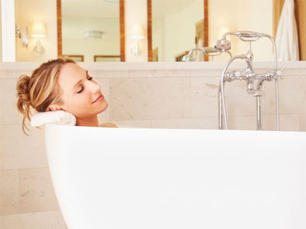 A woman enjoying a bath.
