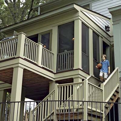 lots of railings leading down the steps of a deck for safety and style
