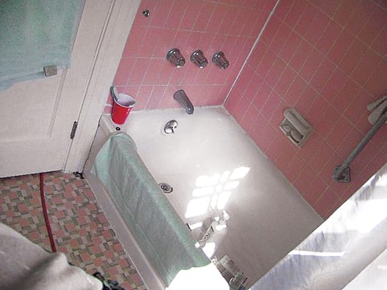 Small dated bathroom before renovation.