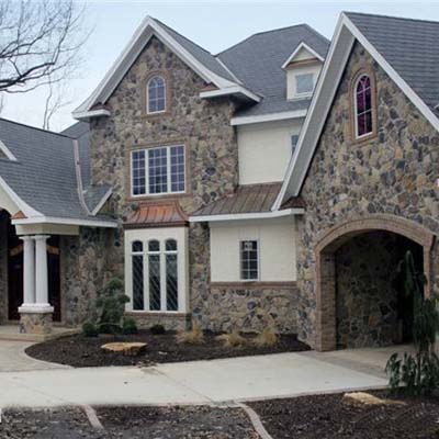 A building with a fire resistant stone veneer.