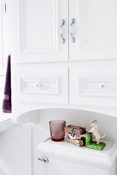 Custom arched cabinet above toilet.