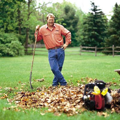 a man raking leaves
