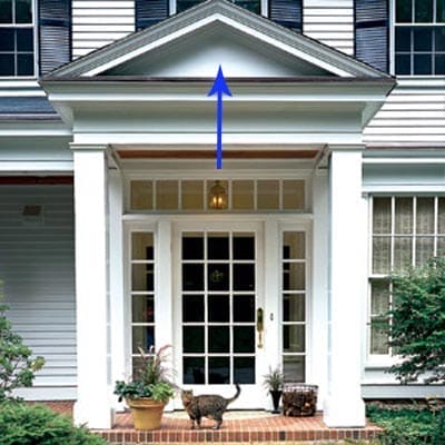 A house with a tympanum above the front door.