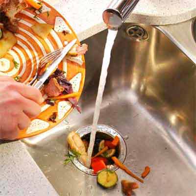 Food going into a garbage disposer