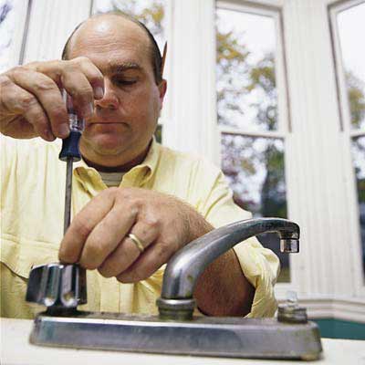 Richard Trethewey fixing a bathroom faucet