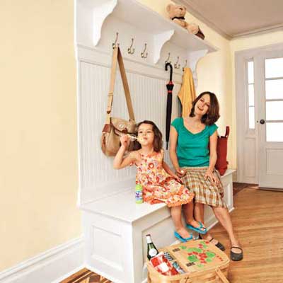 A mom and daughter on a mudroom bench
