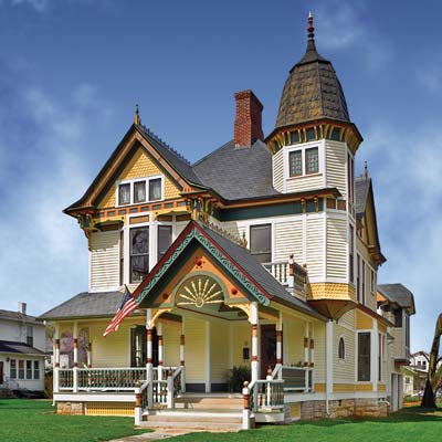 Restored Victorian-style house with intricate architectural details.