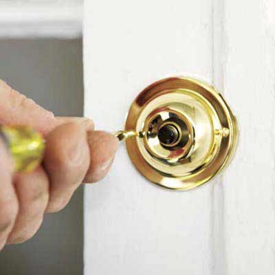 Someone fixing a doorbell