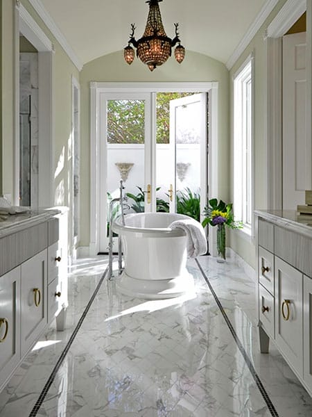 Classic marble tile runner rug design in a bathroom.