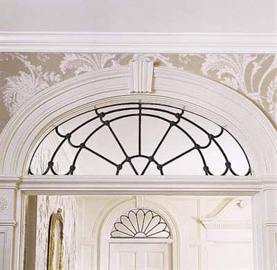 A tall and curvy stock molding in an Italianate house.