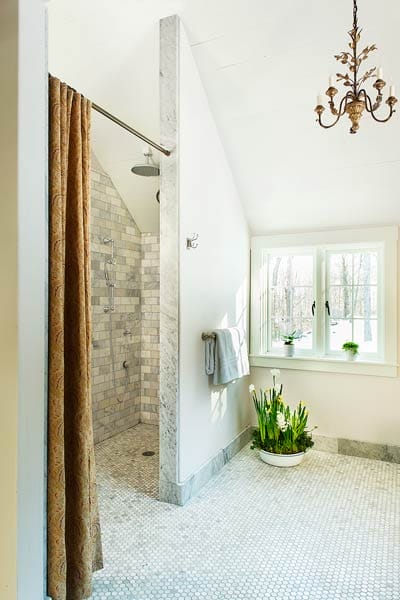 Elegant bathroom with large crystal chandelier.