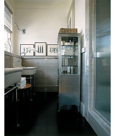 Sophisticated bathroom with marble slabs mounted as wainscoting.
