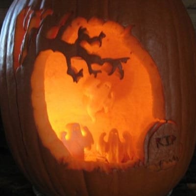 Ghosts in a graveyard pumpkin carving