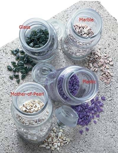 Photo of some of the types of materials that are included within terrazzo flooring. These can include glass, marble, mother-of-pearl, or plastic. 