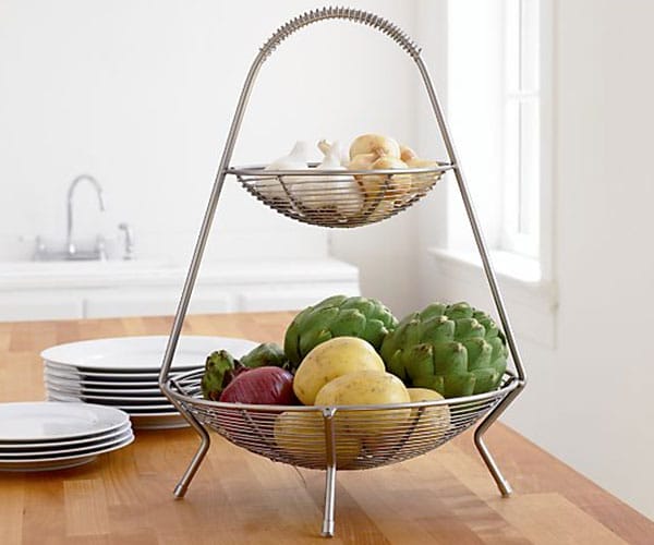 Two-level silver countertop fruit basket.