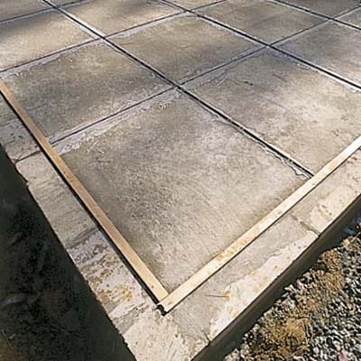 Photo of zinc dividers after being cemented to the floor slab in preparation for the terrazzo floor installation.