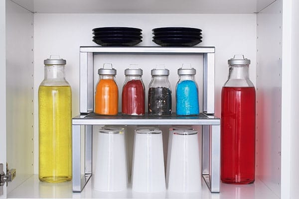 Silver stackable shelf inserts holder plates and glass jars.