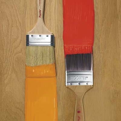 Two paintbrushes with paint