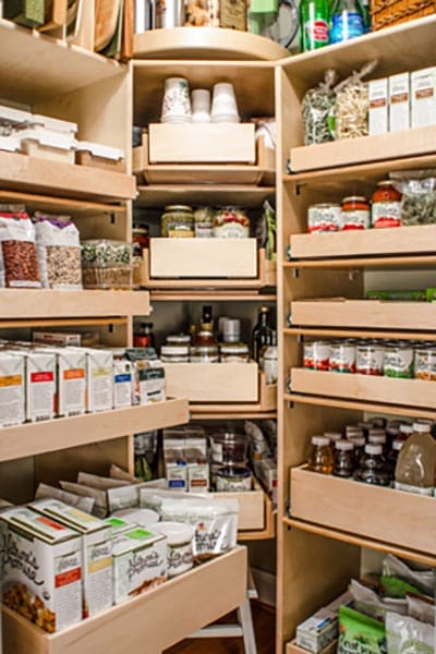 Full pantry with custom sliding built-in storage drawers and shelves.