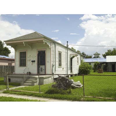 1892 Italianate shotgun house with front porch in Lower Ninth Ward.
