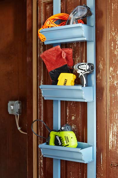 3 storage shelfs constructed from old gutters