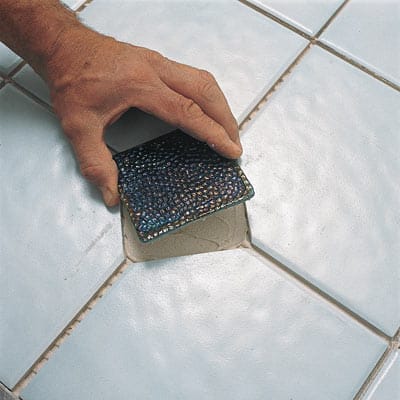 A bathroom upgraded with a new tile floor.