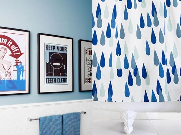 A bathroom made more interesting with art and accessories.