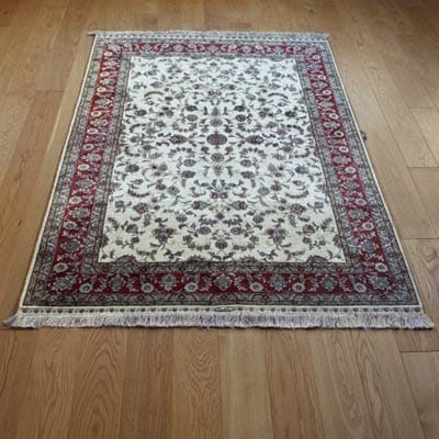 Rug with untangled tassels after using a fork as a comb. 