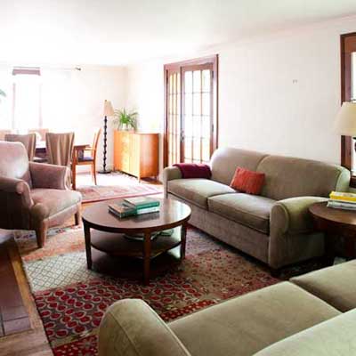 Living room with sofa against the wall.