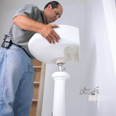 A bathroom upgraded with a pedestal sink.