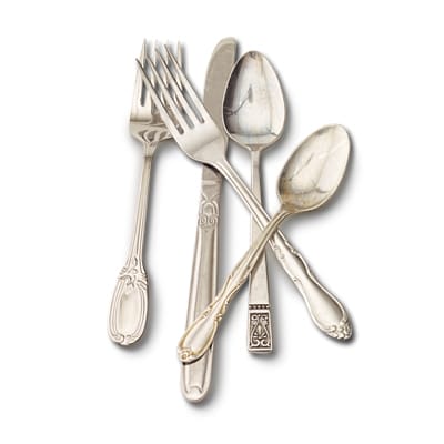 Silverware, including forks, spoons, and a knife