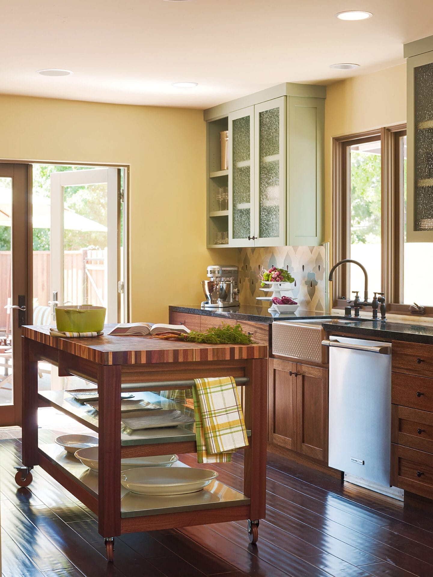 A kitchen island with an organic classic wood countertop.