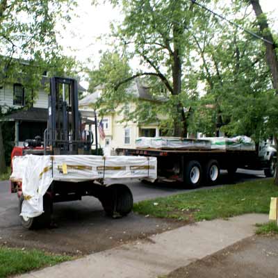 Siding being delivered on a flatbed truck.