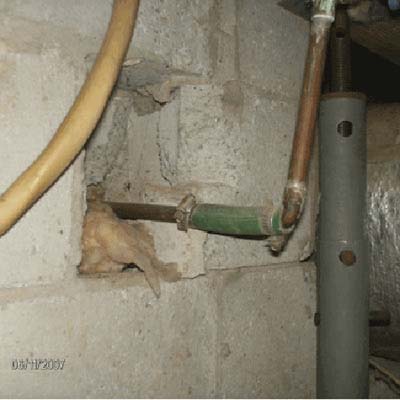 Garden hose used as water pipe connection instead of copper.