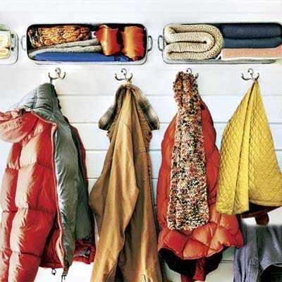 Winter clothes hanging on hooks