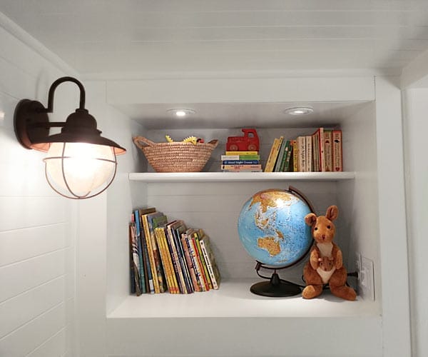 A small built-in bookcase in the bedroom