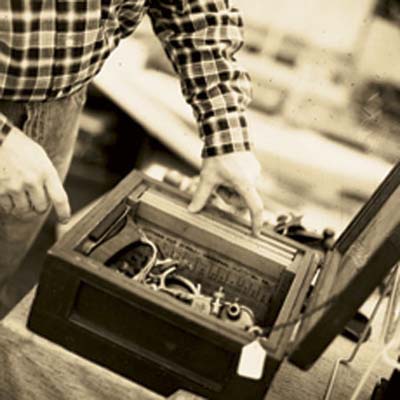 A person looks at vintage hand planes